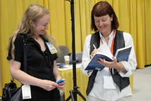 Orna Ross Signing books in The Author Hub