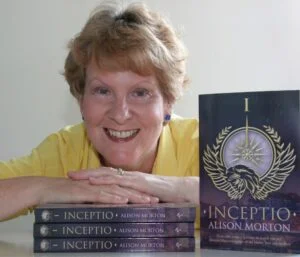 Headshot of Alison Morton with copies of Inceptio