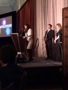 Photo of Rebecca on stage at the awards ceremony