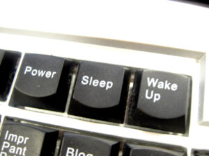 Computer keyboard with keys saying "power", "sleep" and "wake up"
