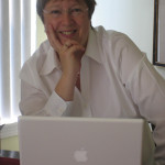 Photo of Jane Steen at her computer