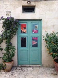 door in courtyard with conference signage