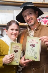 Two readers in period costume from the era of Piers' historical novel
