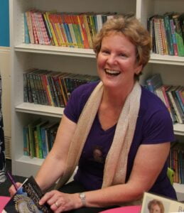Photo of Alison Morton signing books