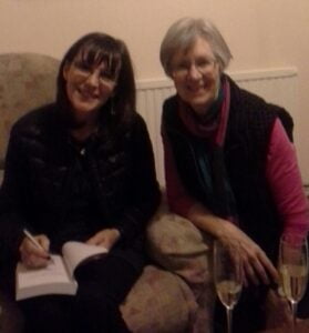 Kathy Joyce signing a book
