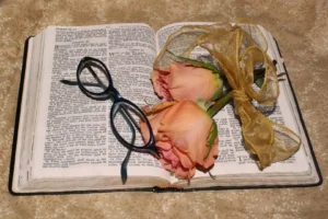 flowers and glasses resting on a book