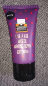 shower gel tube with caption "Live a life worth writing down"