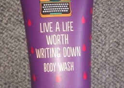 shower gel tube with caption "Live a life worth writing down"