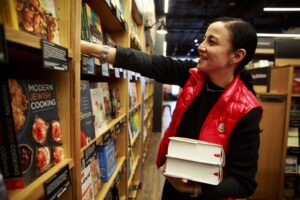 Mika Yamamoto, director of marketing for Amazon Books, works inside of Amazon Books in Seattle Monday, Nov. 2, 2015. Amazon Books, the company's first brick-and-mortar store, will open tomorrow Tuesday, Nov. 3, 2015 in Seattle's University District.