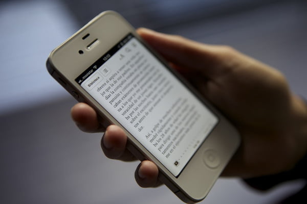 Smartphone being used with a reading app