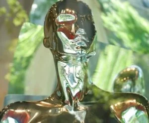 Photo of golden figure of an androgynous person