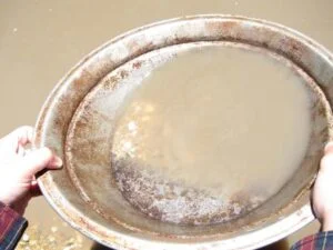 photo of a goldpanning pan with gold stars in it