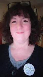 Debbie Young wearing festival badge