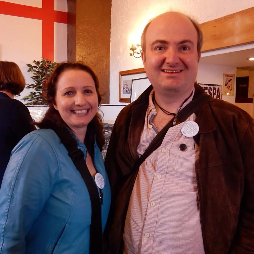 photo of Joanna Penn and Thomas Shepherd wearing author badges