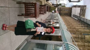 Debbie Young on the terrace of the House of Commons wearing a bright red beret