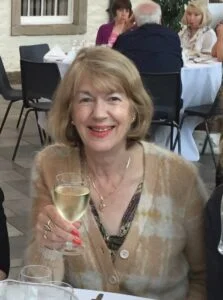 Photo of Denise with a glass of wine