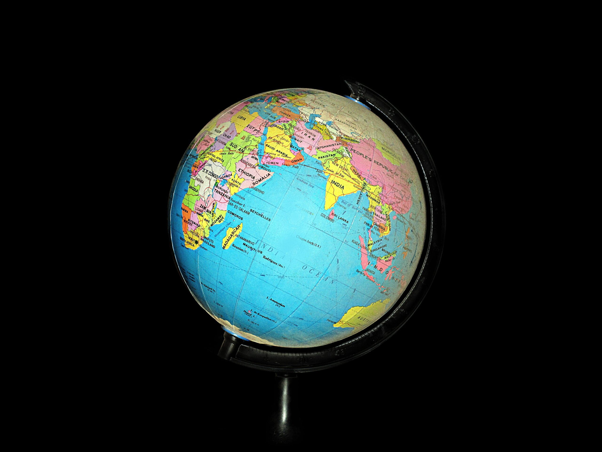 Photo Of A Globe Against A Black Background