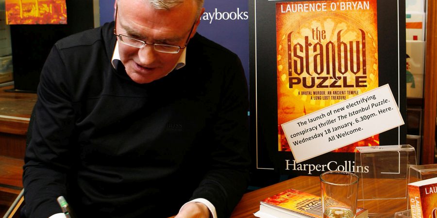 Photo Of Laurence O'Bryan Signing A Book