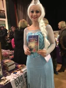 Princess from Frozen film holdingone of Wendy's books