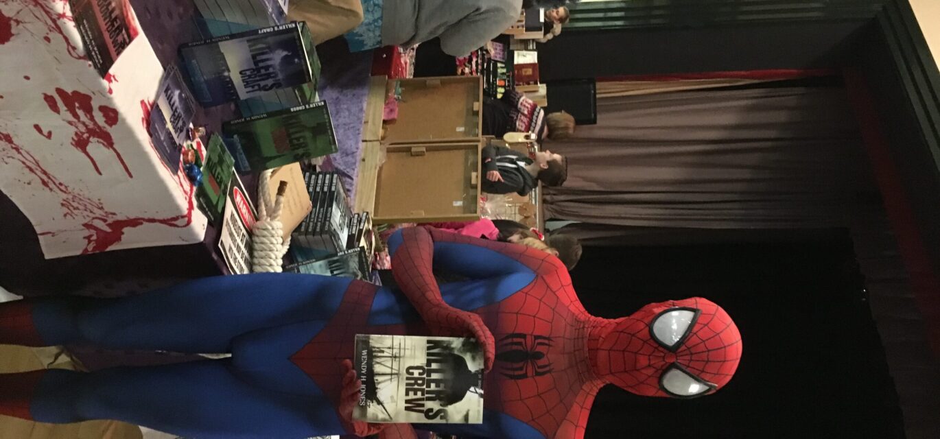 Spiderman holding one of Wendy Jones's books