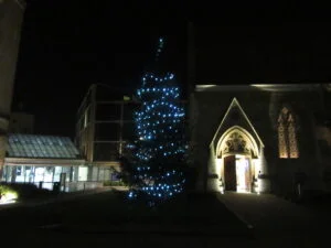 straddling the old and new, digital and physical, Oxford Christmas tree between historic St Luke's Chapel and the brand new Maths Institute