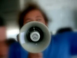 photo of a person shouting through a megaphone