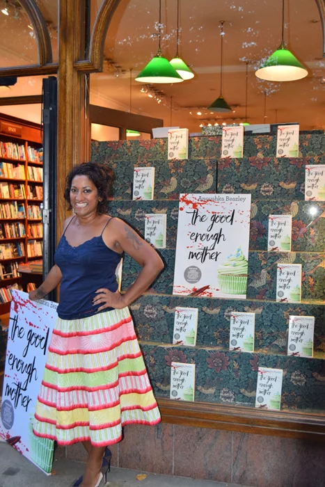 Author Outside Bookshop Window