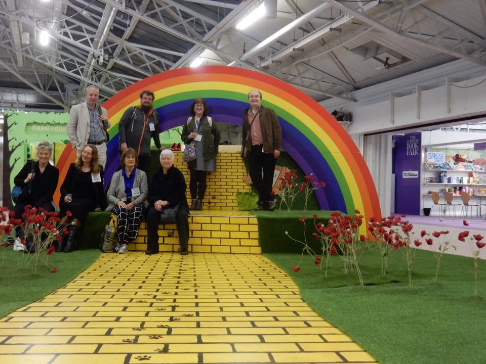 Yellow brick road and rainbow set with group of authors 