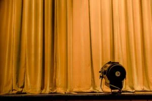 Photo of spotlight on a stage curtain