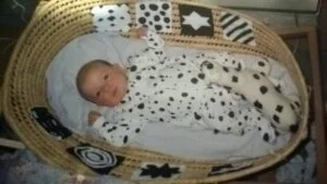 photo of baby in black and white outfit