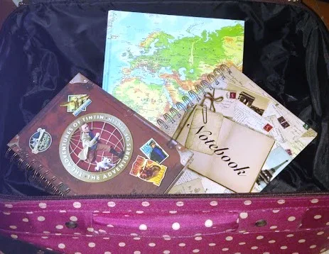 image of notebooks in a suitcase