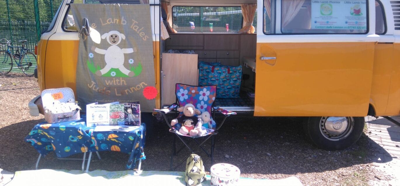 image of books and props with camper van