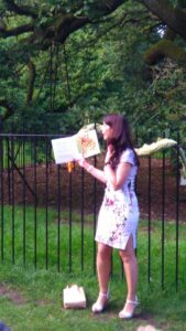 Jude Lennon giving a public reading of one of her books