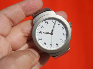 image of a watch in someone's hand
