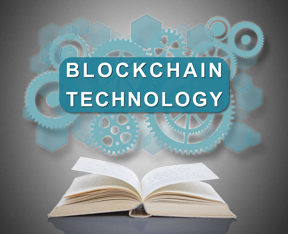 Blockchain technology concept above an open book