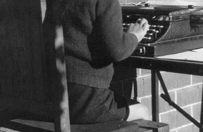 Image Of Small Boy At Typewriter