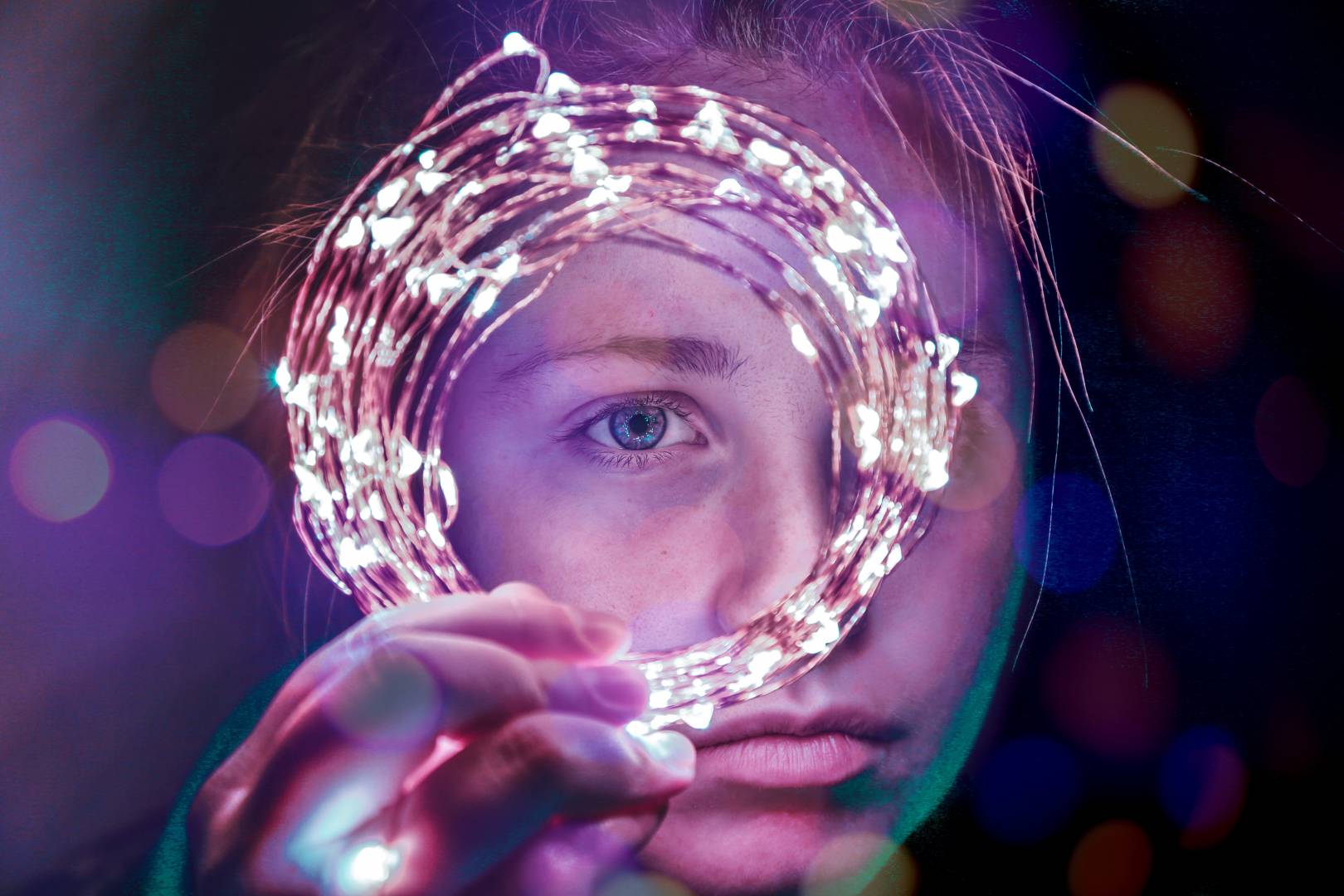 Photo Of Girl Looking Through Circle Of Lights By Brendan Church Via Unsplash.com