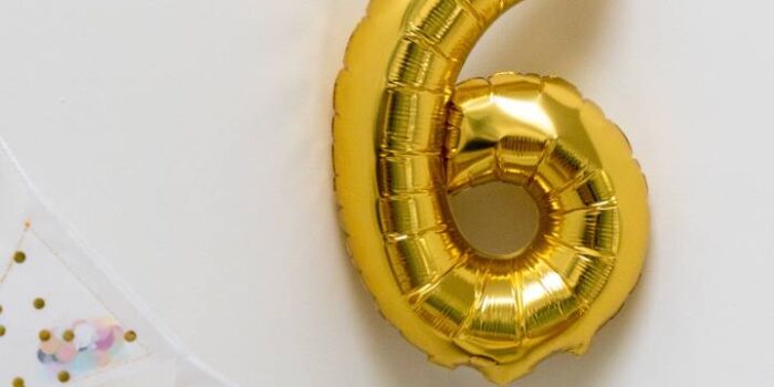 photo of balloon shaped like a number 6 with bunting