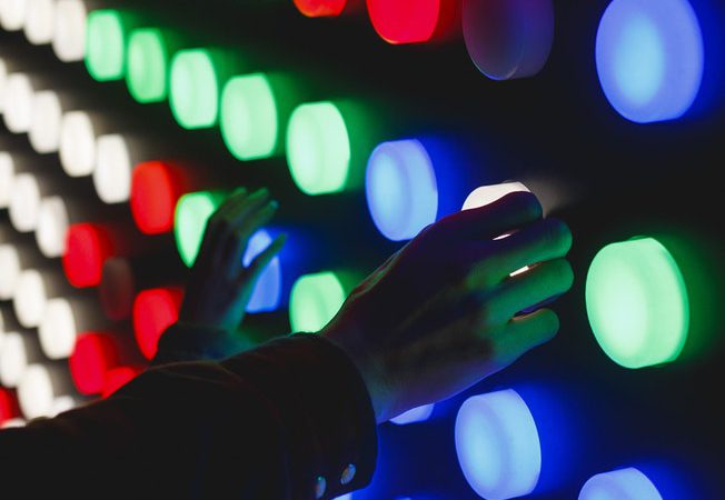 Photo By Katya Austin On Unsplash Of Hands On Different Coloured Lights Looking Like An Experiment