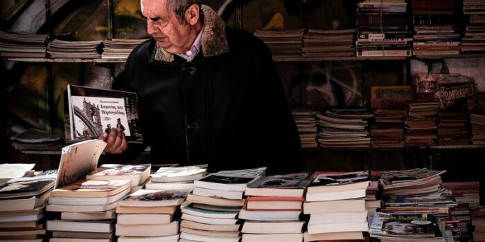 old man browsing bookstall