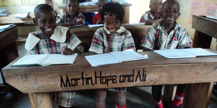 Image Of School Desk In Uganda With Author Names On It