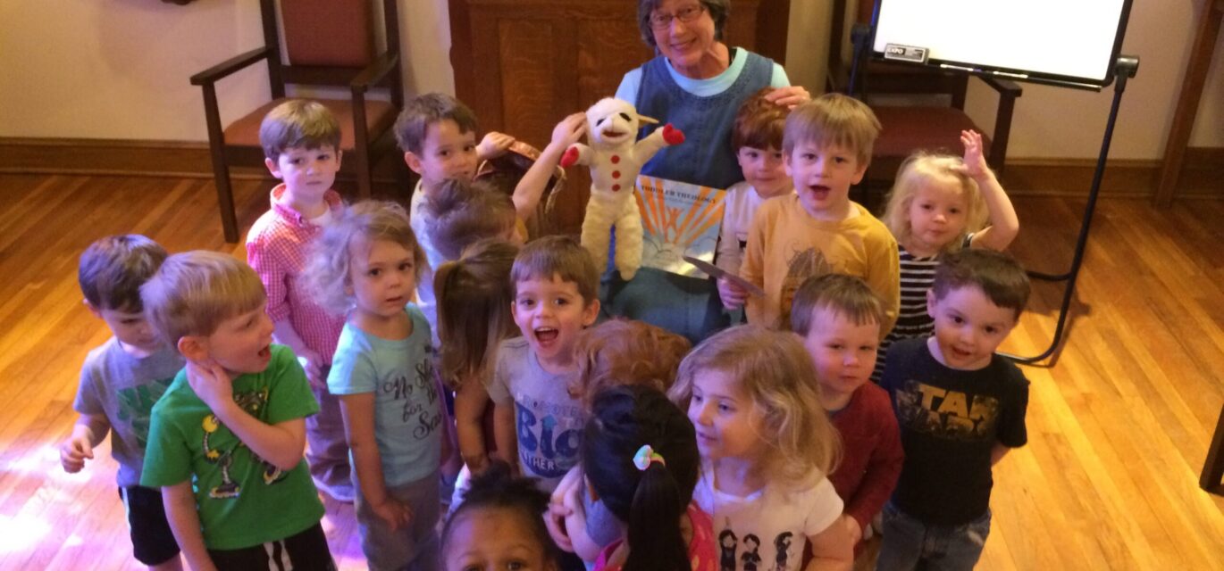 Photo of Cathy with lots of toddlers