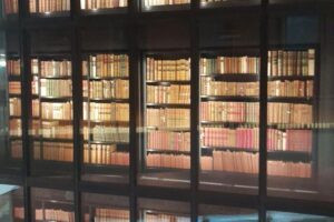 image of old books behind glass cases at the British Library