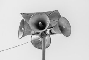 Speakers in black and white photo