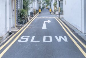 Slow sign painted on road