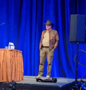 Conference founder Craig Martelle dresses as Indiana Jones to kick off Cosplay Day.