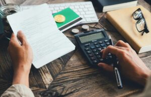 Money Management: hands with calculator