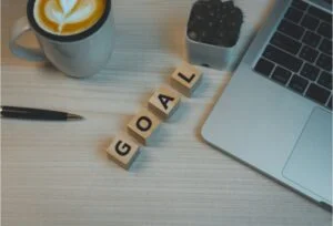 Goal written on desk Member Milestones image